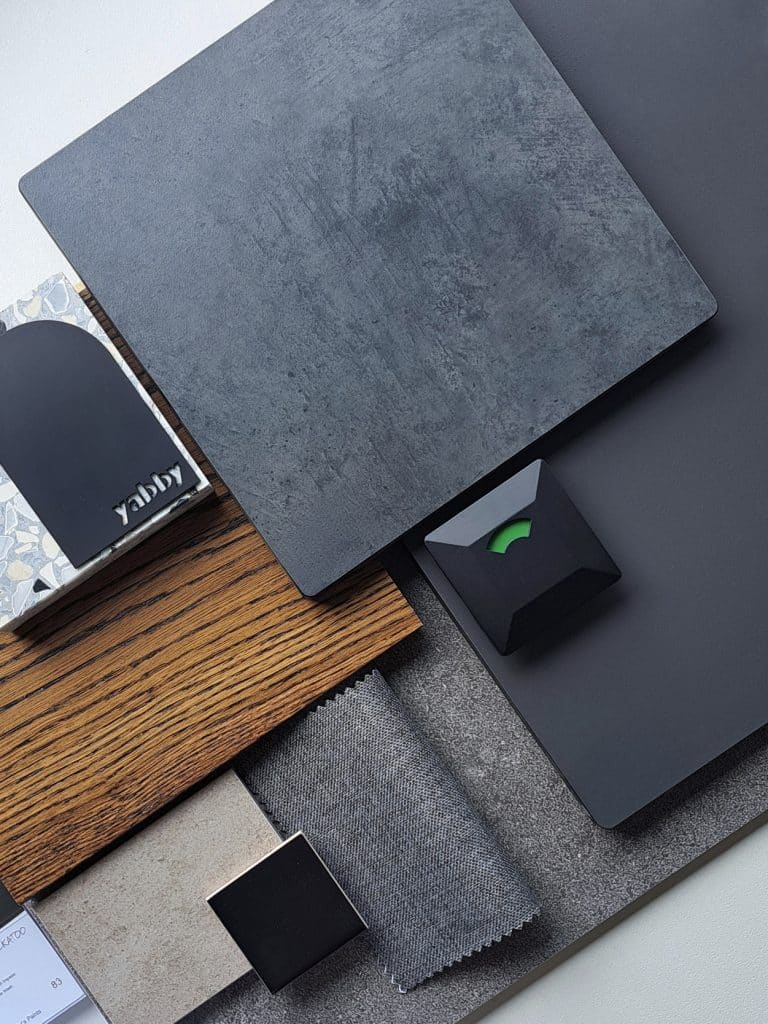 Dark Opulence palette — Deep Woods, Slate, Midnight Acacia compact laminate samples with styling props