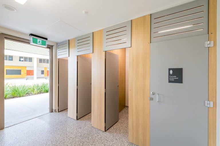 t: Compact laminate ambulant cubicle and vanity in a Queensland school amenity block
