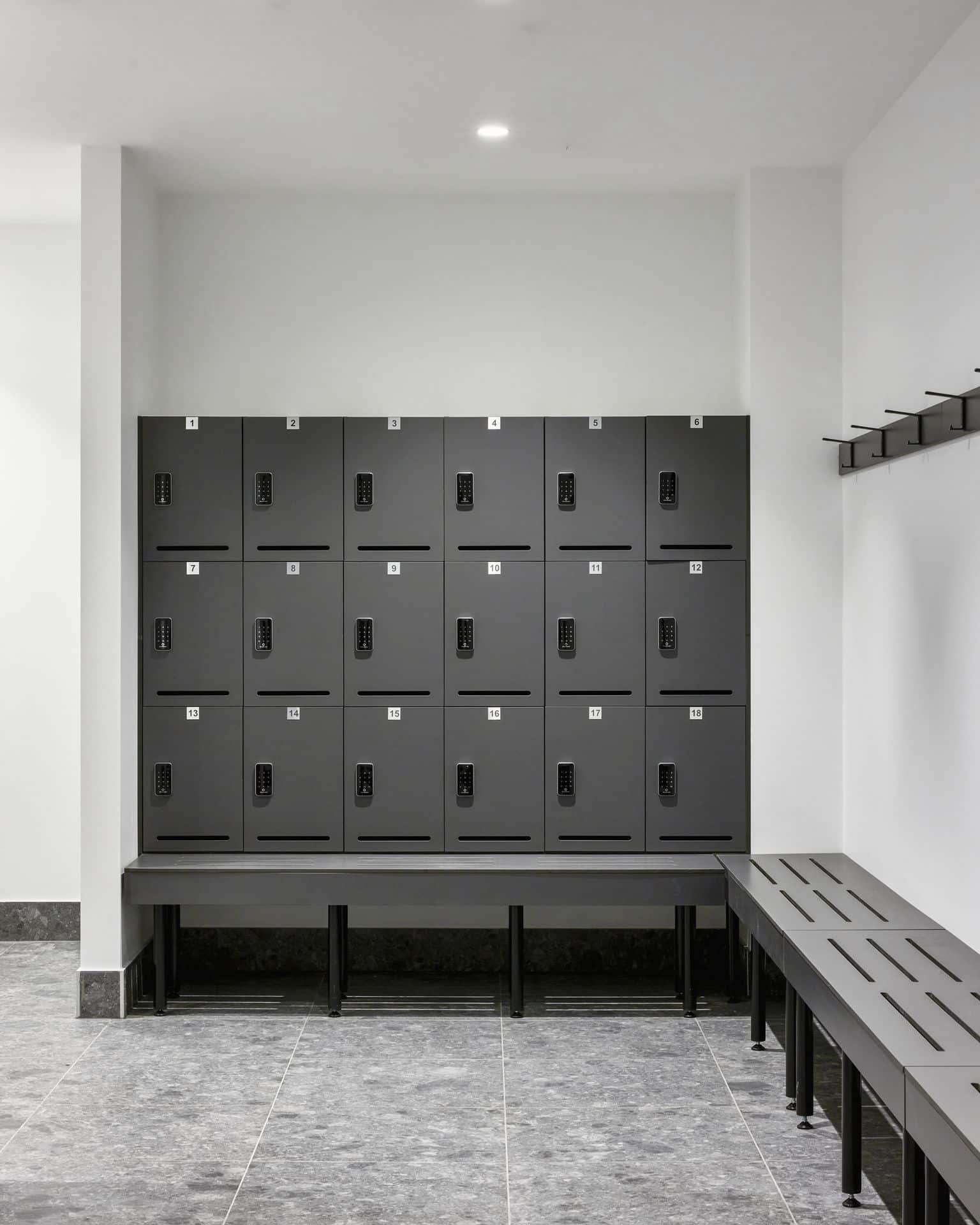 Bench mounted lockers with integrated seating in a change facility