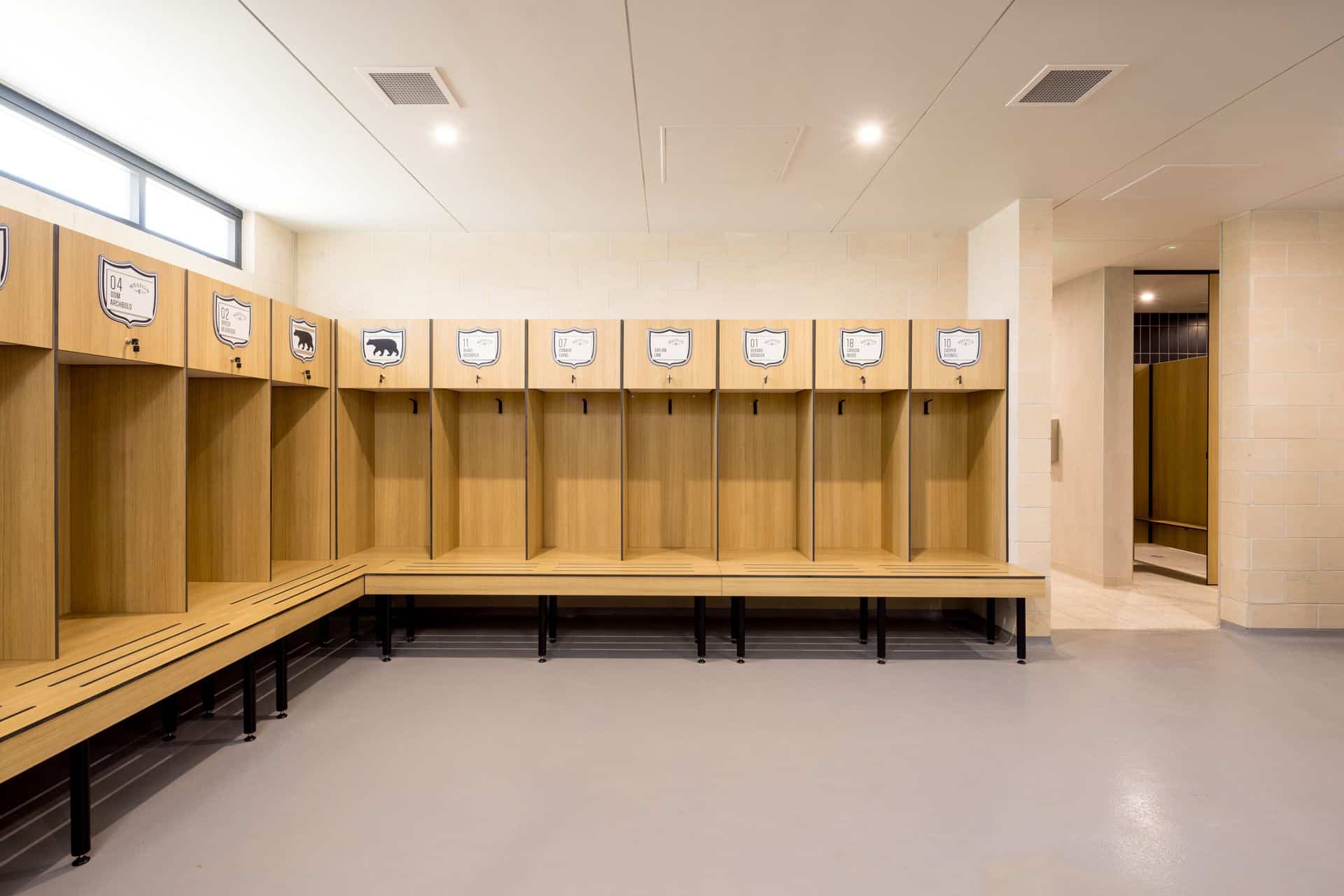 Change room at Weston Bears Park with Philippine Teak compact laminate partitions and bench seating