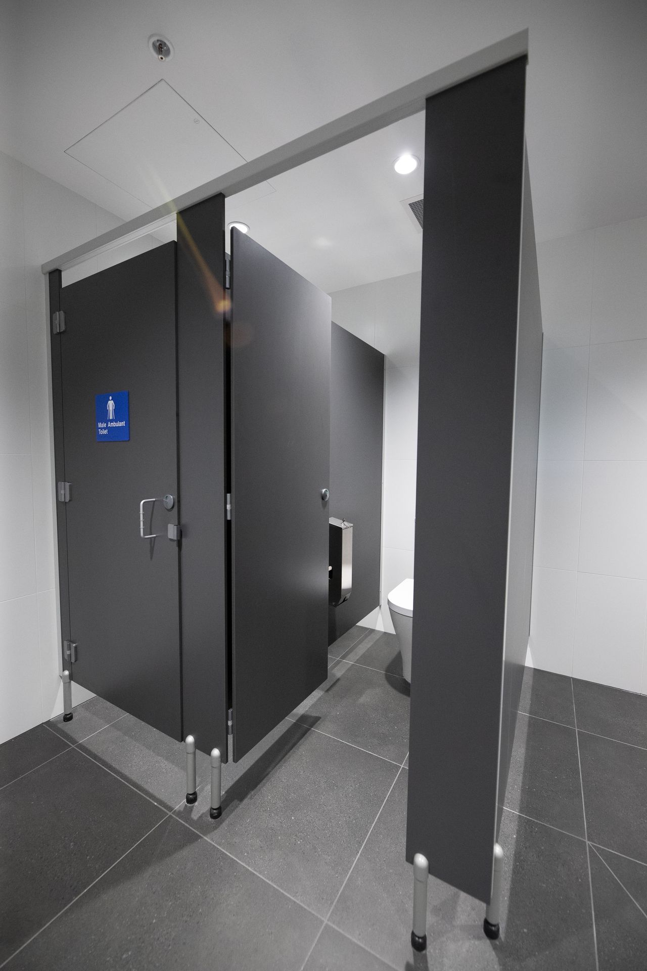 Pedestal Mount Overhead Braced toilet partitions in an industrial amenity block