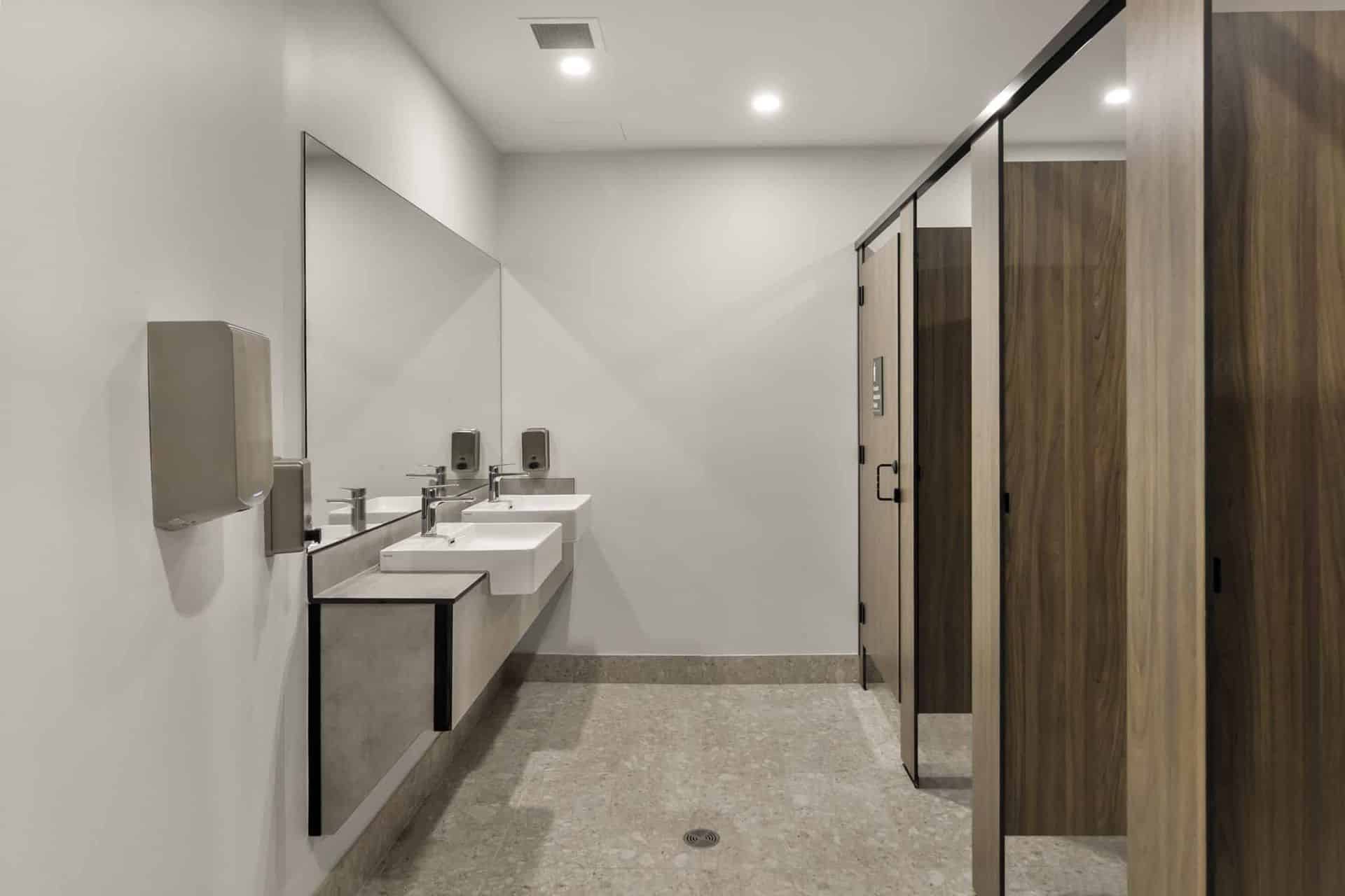 Compact laminate vanity bench in an industrial amenity block