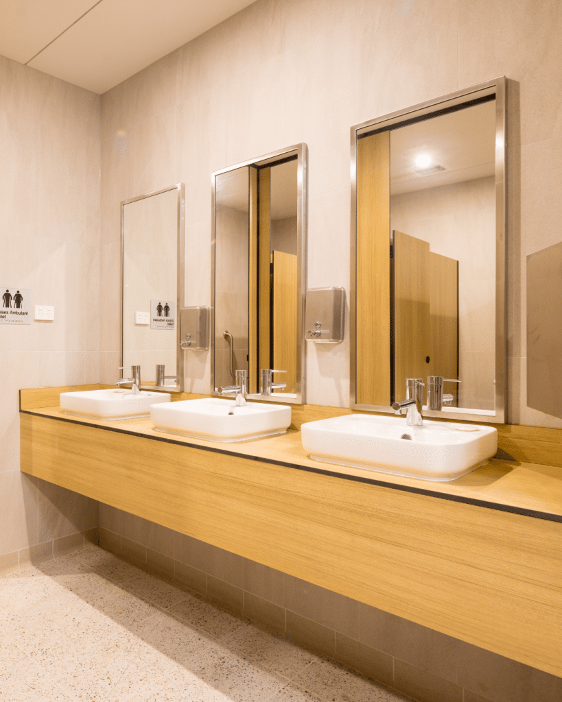 Commercial compact laminate vanity bench surface installed in an executive office washroom